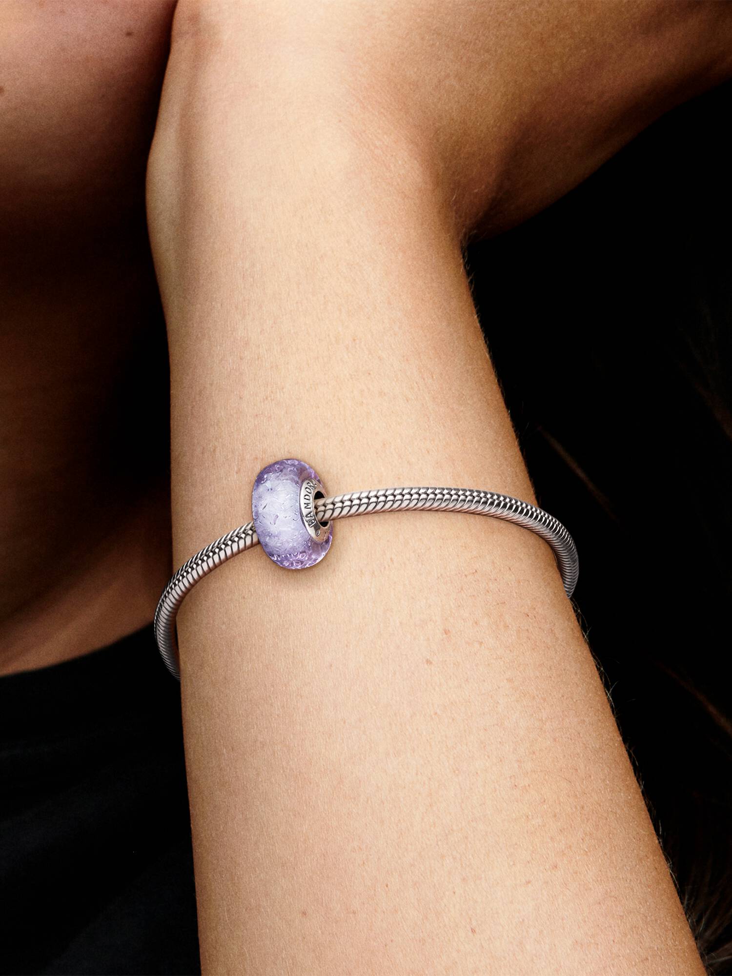 Wavy sterling silver charm with iridescent and lavender Murano glass